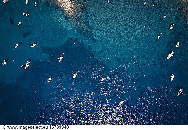 Italy  Province of Livorno  Elba  Aerial view of boats floating in blue waters of Mediterranean Sea