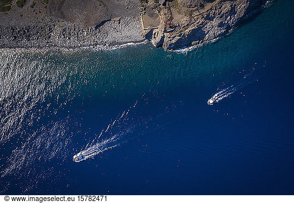Italy  Province of Livorno  Elba  Aerial view of boats sailing near coast of Mediterranean Sea