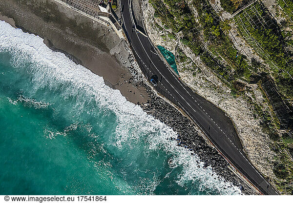 Italy  Province of Salerno  Amalfi  Drone view of asphalt road stretching along Amalfi Coast