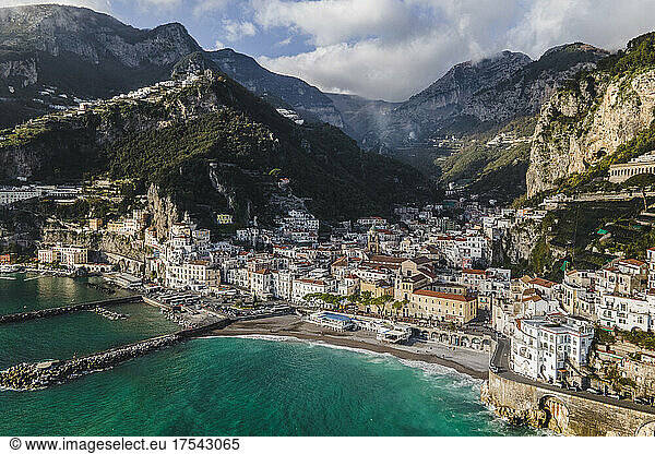 Italy  Province of Salerno  Amalfi  Drone view of town on Amalfi Coast with mountains in background