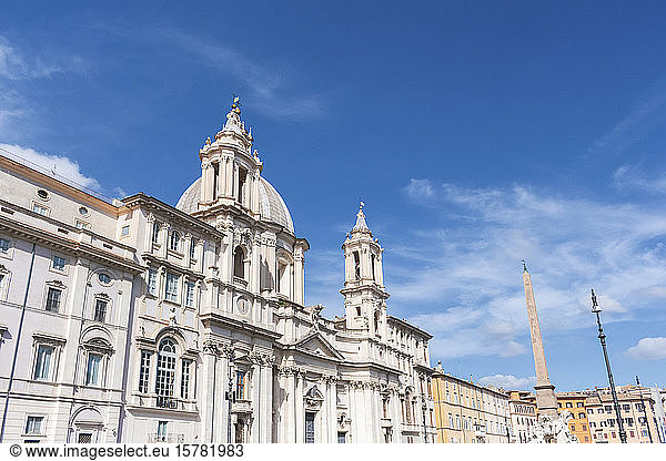 Italy  Rome  Low angle view of Sant Agnese in Agone church with Agonalis obelisk in background