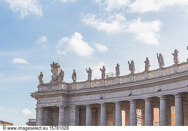 Italy  Rome  Sculptures standing on top of colonnade of Saint Peters Square