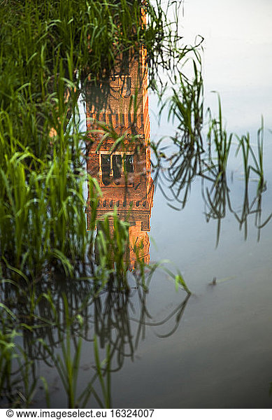 Italy  Roncade  reflection of tower on water surface of a moat