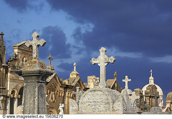 Italy  Sicily  Alcamo  gravestones against moody sky