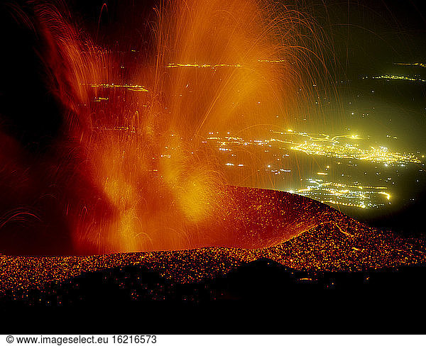 Italy  Sicily  Etna erupting with Catania in background
