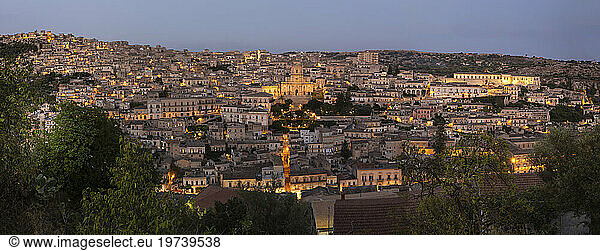 Italy  Sicily  Modica  Panoramic view of old town district at dusk