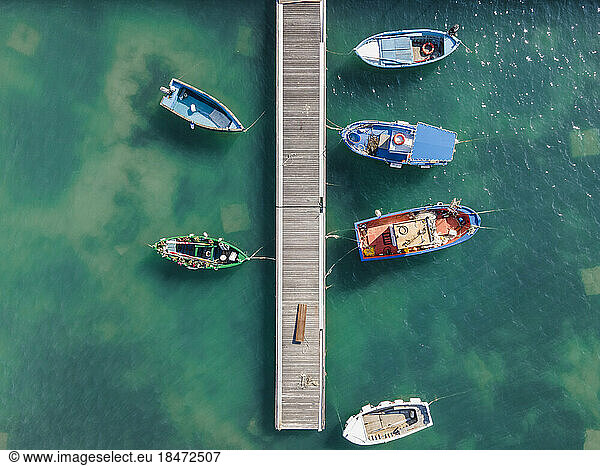 Italy  Sicily  Pachino  Aerial view of boats moored to coastal jetty