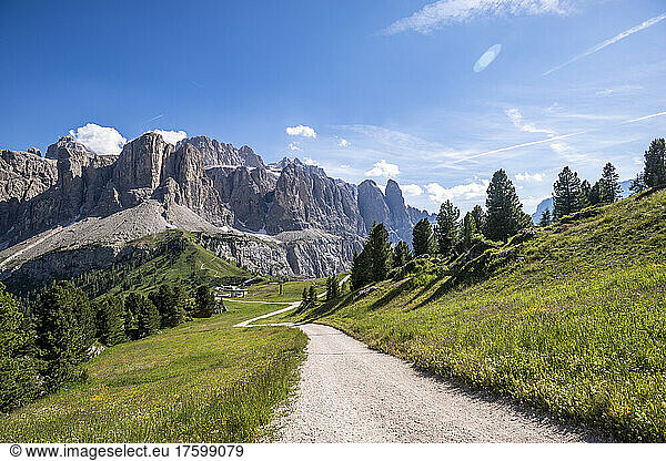 Italy  South Tyrol  Dirt road in Gardena Pass with Sella Group massif in background