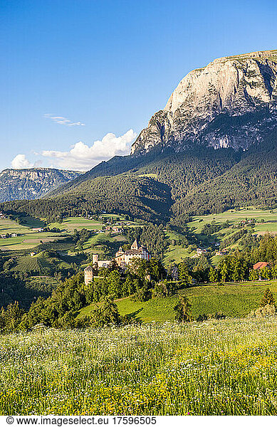 Italy  South Tyrol  Vols am Schlern  View of Prosels Castle in summer with meadow in foreground and Schlern in background
