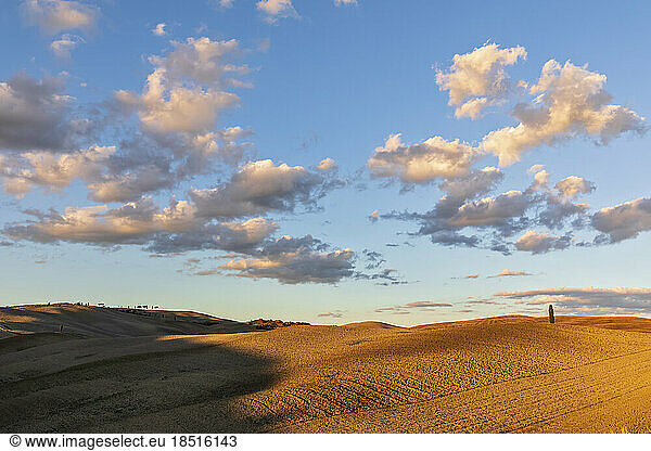 Italy  Tuscany  San Quirico d'Orcia  Clouds over rolling landscape of Val d'Orcia at dusk
