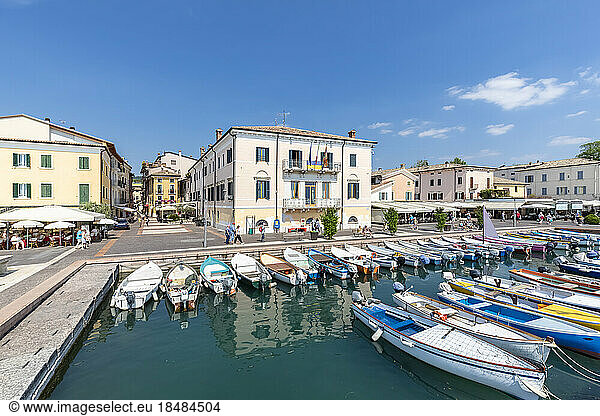Italy  Veneto  Bardolino  Rows of boats moored in town harbor