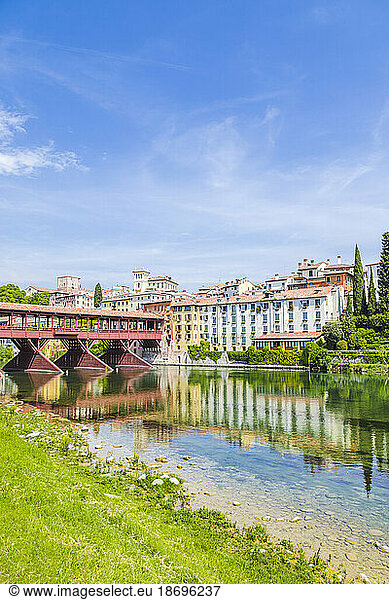 Italy  Veneto  Bassano del Grappa  River Brenta with buildings and Ponte Vecchio in background