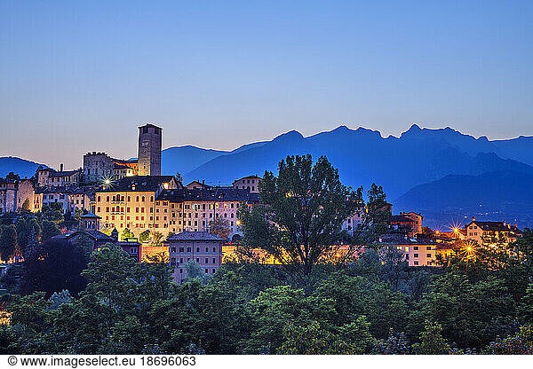 Italy  Veneto  Feltre  Illuminated town in Dolomites at dusk
