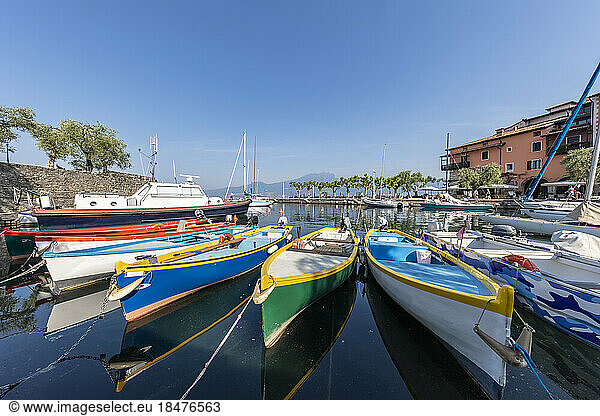 Italy  Veneto  Torri del Benaco  Boats moored on shore of Lake Garda
