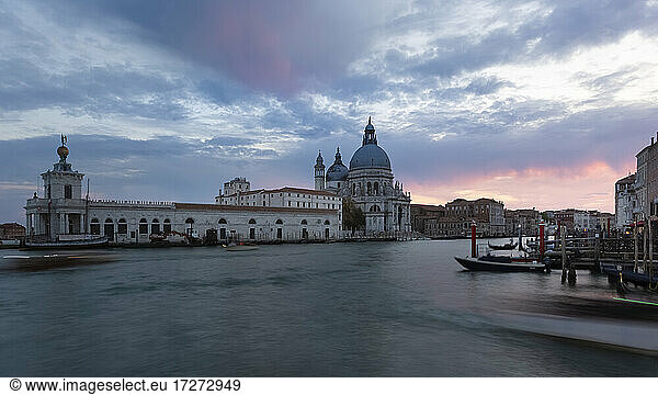Italy  Veneto  Venice  Clouds over canal in front of Santa Maria della Salute at dusk