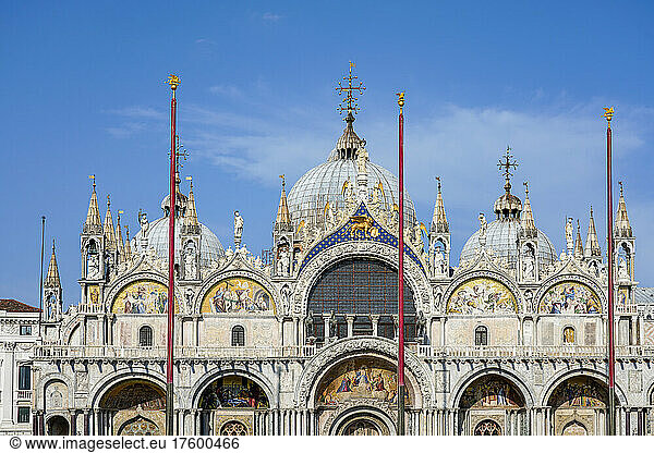Italy  Veneto  Venice  Flagpoles against facade of Saint Marks Basilica