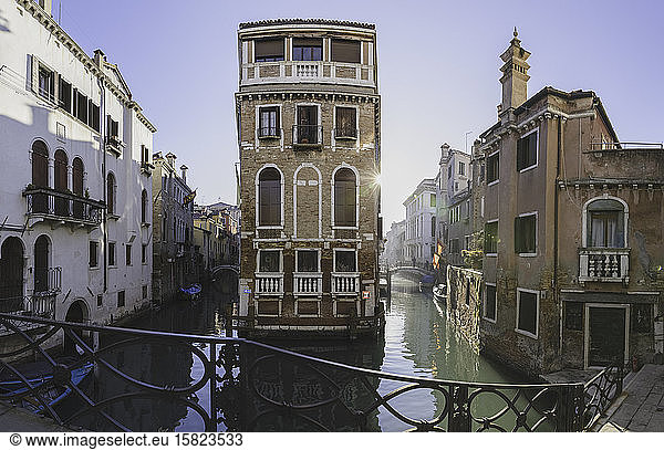 Italy  Venice  Sun illuminating houses along Venetian canal