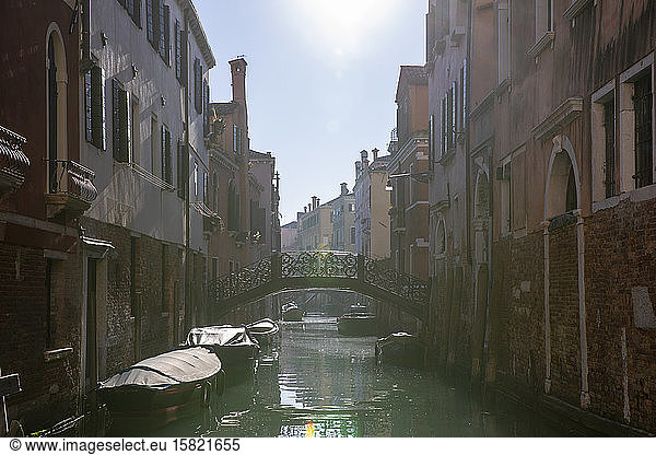 Italy  Venice  Sun shining over Venetian canal