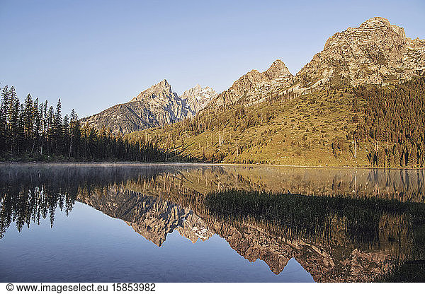 Jagged peaks of Grand Teton National Park reflected in String Lake