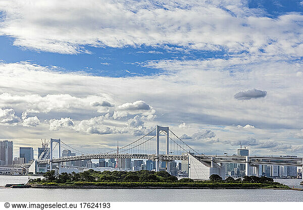 Japan  Kanto Region  Tokyo  Clouds over Odaiba island with Rainbow bridge in background