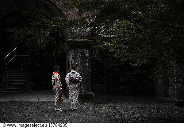 Japan  Kyoto  Rear view of two women wearing kimono