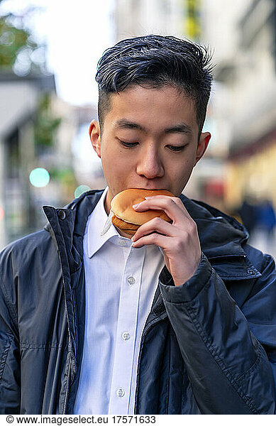 Japanese eating a delicious hamburger