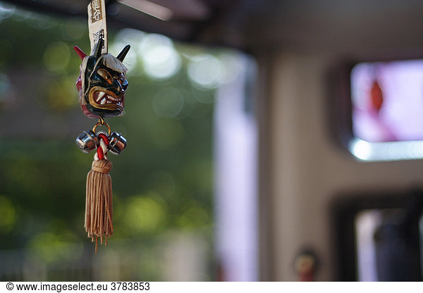 Japanese lucky charm in a bus