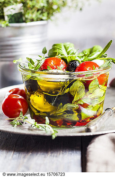 Jar of fresh Caprese salad preserved in olive oil