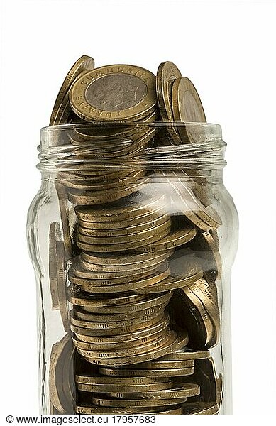 Jar of Turkish coins in front of white background