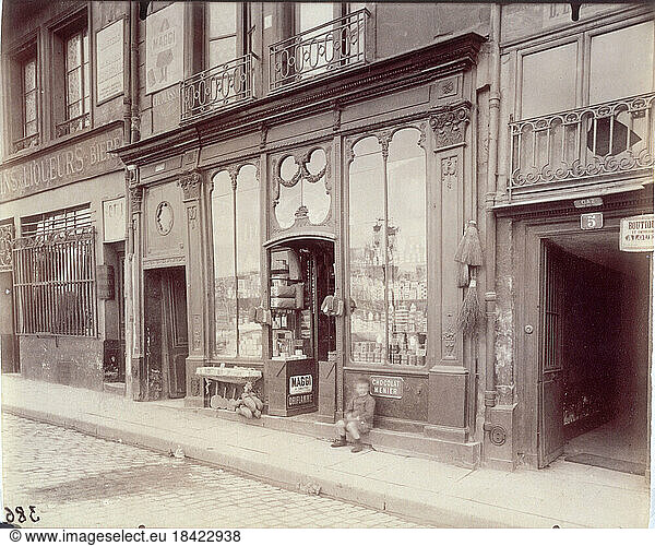 Jean Eugène Auguste Atget  1857–1927.“Boutique Louis XVI. 3  quai Bourbon  3ème arrondissement  Paris' (Louis XVI shop. Quai Bourbon 3  3rd arrondissement  Paris)  in 1900.Photography  Albumen print.PH5736 Paris  Musée Carnavalet.
