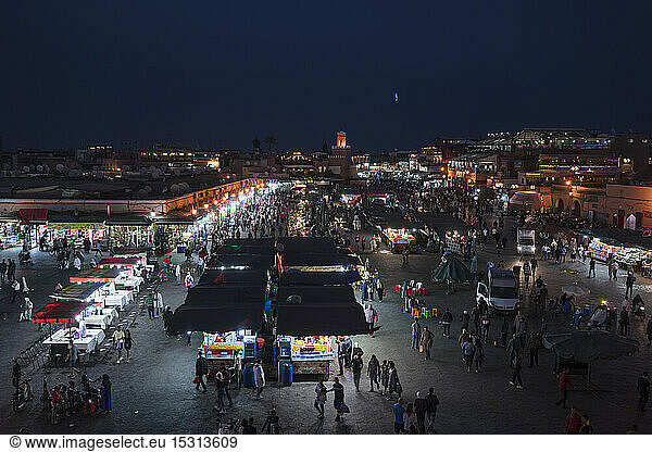 Jemaa el-Fnaa at sunset  bustling coartyard and market square  Marrakesh  Morocco