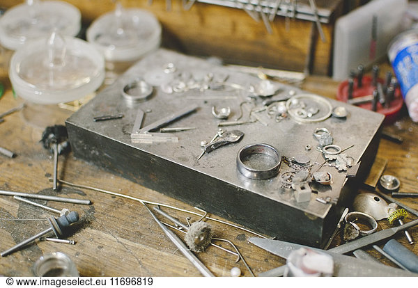 Jewelry making tools on workbench in workshop