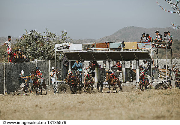 Jockeys competing in traditional horse racing