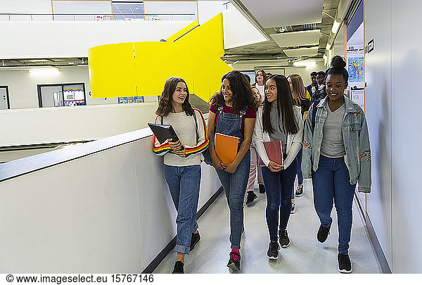 Junior high girl students walking in corridor