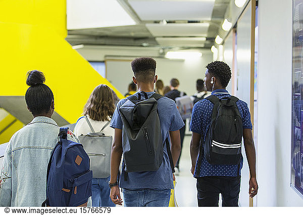 Junior high students walking in corridor