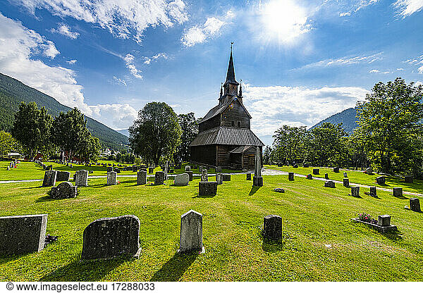 Kaupanger Stave Church amidst cemetries at Kaupanger  Vestland  Norway