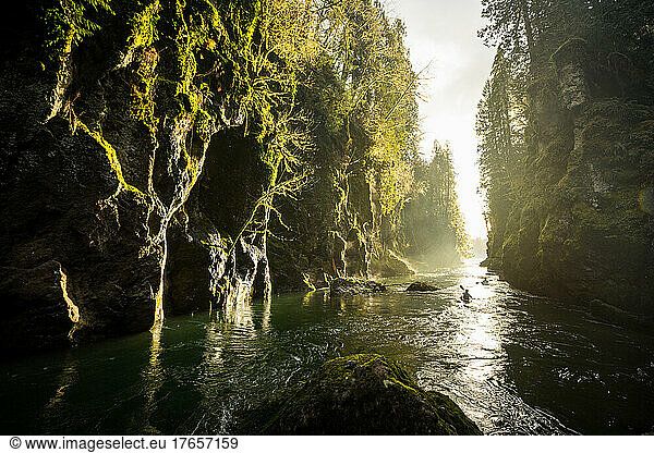 Kayakers paddle through a canyon on the Tilton River in Washington