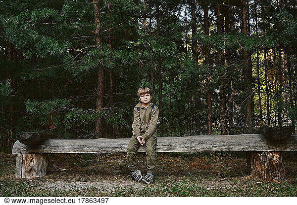 Kid in the forest. Childhood with nature loving concept