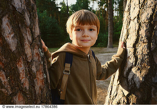 Kid in the forest. Childhood with nature loving concept