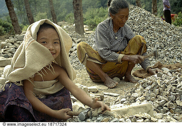 Kids crushing gravel to provide family income in Hetauda  Nepal.
