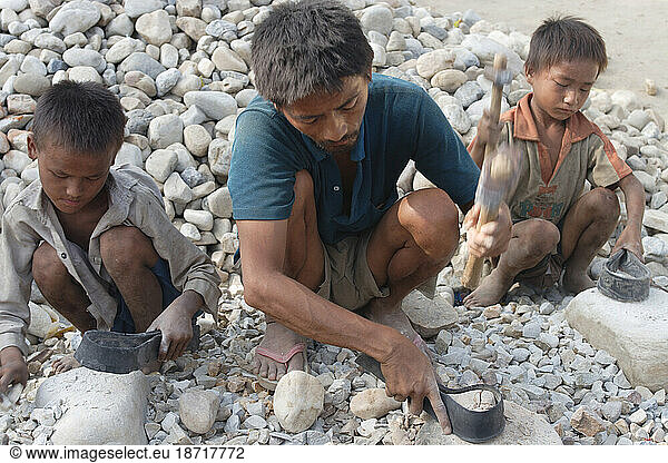 Kids crushing gravel to provide family income in Hetauda  Nepal.