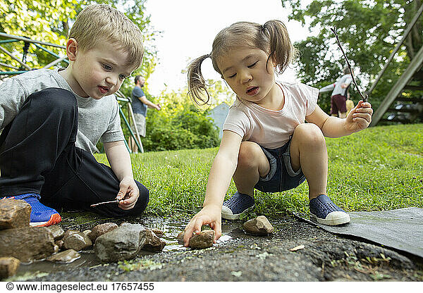 Kids Engaging in Creative Free Play Outdoors in Backyard