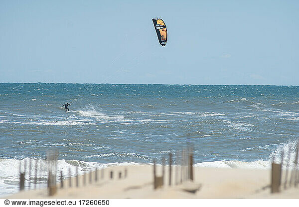 Kiteboarder Ian Brown in Atlantic Ocean waves off Nags Head  North Carolina  United States of America  North America