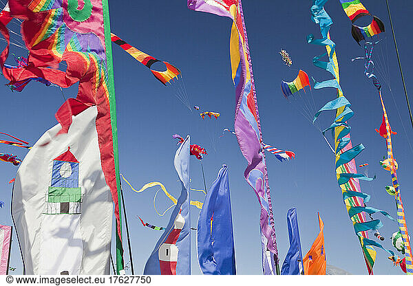 Kites  banners and streamers waving in the wind.