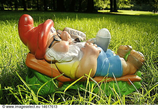 kitsch  hokum  garden gnome  lie in grass  Germany  circa 1977