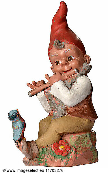 kitsch / souvenirs  garden gnome  playing a song on the flute  bird is sitting on his forward section of foot and listening to him  Germany  circa 1959