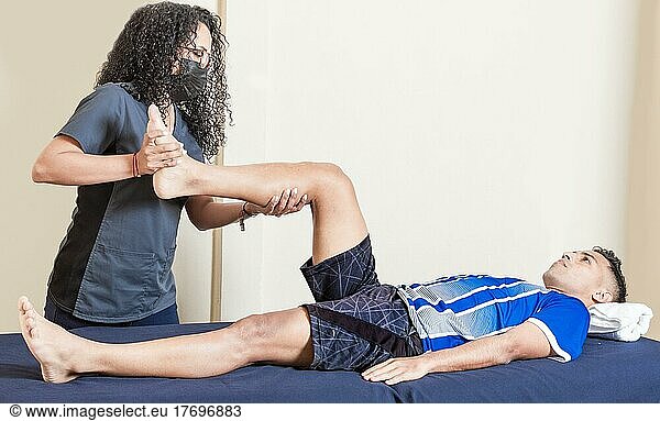 Knee rehabilitation physiotherapy  female doctor with patient undergoing knee treatment