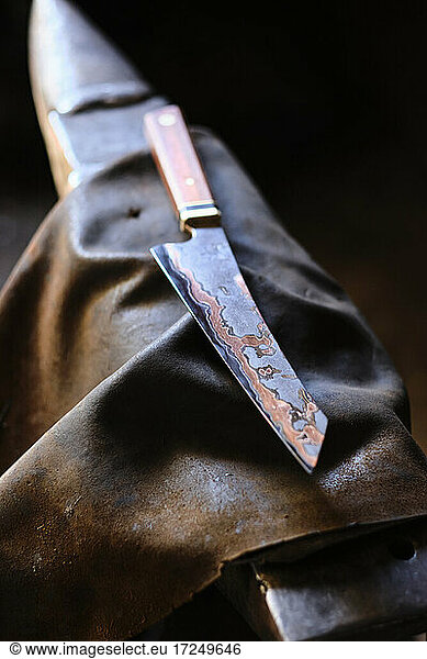Knife on apron at workshop