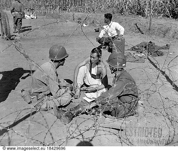 Korea: During the Korean War (1950-1953) an interrogation team of the US 7th Infantry Division question a POW  Anvang-Ni  20 September  1950.The Korean War (25 June 1950 - armistice signed 27 July 1953) was a military conflict between the Republic of Korea  supported by the United Nations  and North Korea  supported by the People's Republic of China (PRC)  with military material aid from the Soviet Union. The war was a result of the physical division of Korea by an agreement of the victorious Allies at the conclusion of the Pacific War at the end of World War II.The Korean peninsula was ruled by Japan from 1910 until the end of World War II. Following the surrender of Japan in 1945  American administrators divided the peninsula along the 38th Parallel  with United States troops occupying the southern part and Soviet troops occupying the northern part. The failure to hold free elections throughout the Korean Peninsula in 1948 deepened the division between the two sides  and the North established a Communist government. The situation escalated into open warfare when North Korean forces invaded South Korea on 25 June 1950. It was the first significant armed conflict of the Cold War.The United Nations  particularly the United States  came to the aid of South Korea in repelling the invasion. A rapid UN counter-offensive drove the North Koreans past the 38th Parallel and almost to the Yalu River  and the People's Republic of China (PRC) entered the war on the side of the North. The Chinese launched a counter-offensive that pushed the United Nations forces back across the 38th Parallel.The Soviet Union materially aided the North Korean and Chinese armies. In 1953  the war ceased with an armistice that restored the border between the Koreas near the 38th Parallel and created the Korean Demilitarized Zone (DMZ)  a 2.5-mile (4.0 km) wide buffer zone between the two Koreas. Minor outbreaks of fighting continue to the present day.