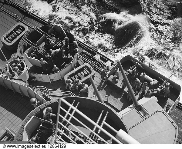 KOREAN WAR: BATTLESHIP. Men of the battleship U.S.S. 'Wisconsin' man their battle stations off the coast of Korea. Photographed 1952.